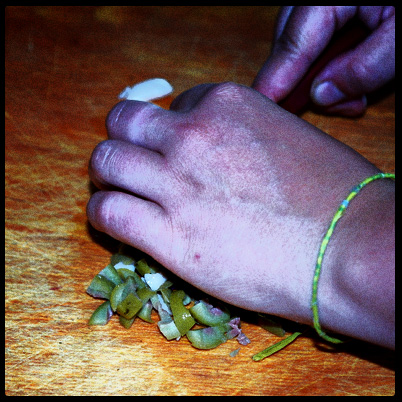 Chopping the garlic-stuffed olives